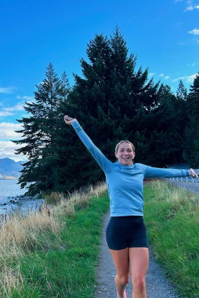 Ella smiling in a field